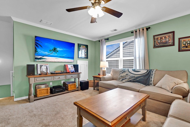 carpeted living room featuring ornamental molding and ceiling fan