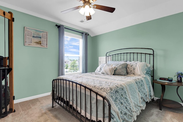 bedroom with crown molding, ceiling fan, vaulted ceiling, and carpet