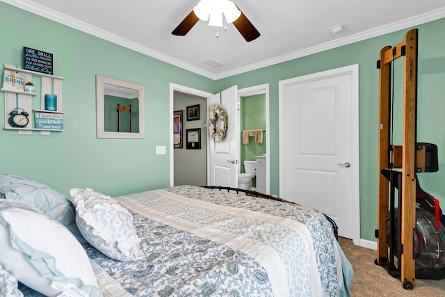 bedroom with connected bathroom, ornamental molding, ceiling fan, and carpet flooring