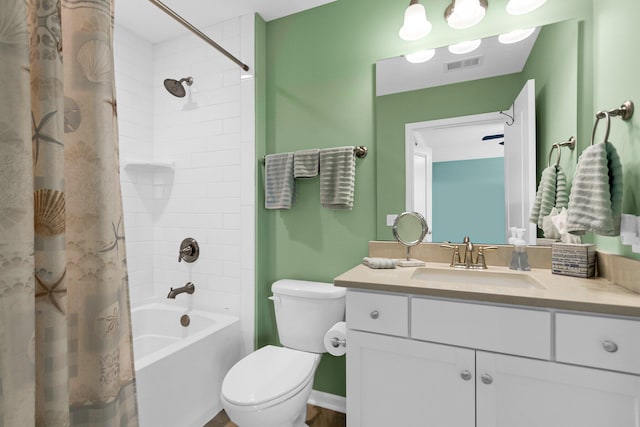 full bathroom featuring shower / bathtub combination with curtain, vanity, and toilet