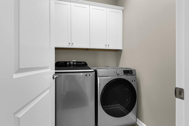 laundry area featuring cabinets and washer and dryer