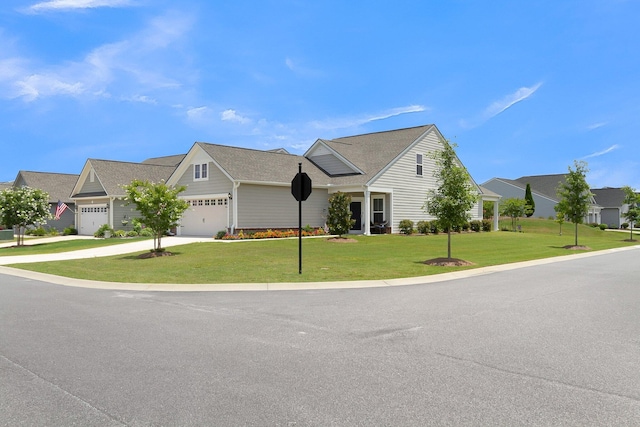 view of front facade with a garage and a front yard