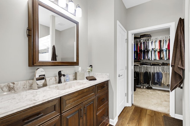 bathroom featuring vanity and wood-type flooring