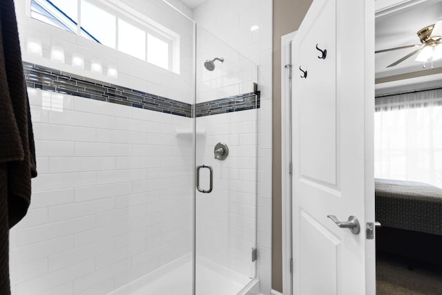 bathroom with walk in shower and ceiling fan