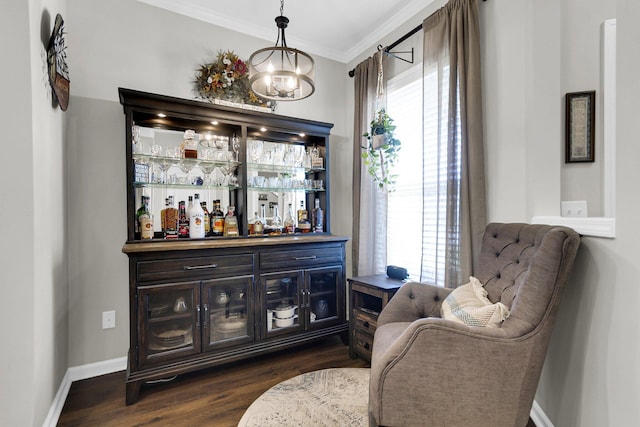 bar with ornamental molding, plenty of natural light, dark hardwood / wood-style flooring, and decorative light fixtures