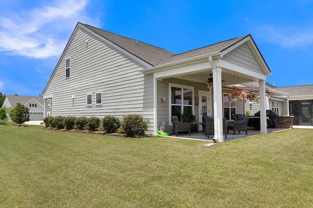 rear view of house featuring an outdoor living space, a patio area, ceiling fan, and a lawn