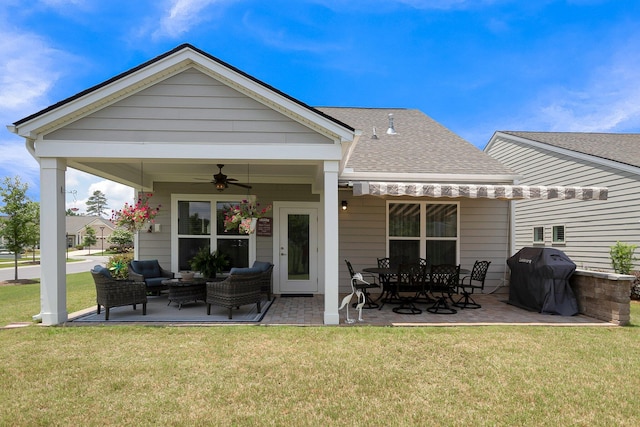 back of property featuring a yard, a patio, and ceiling fan