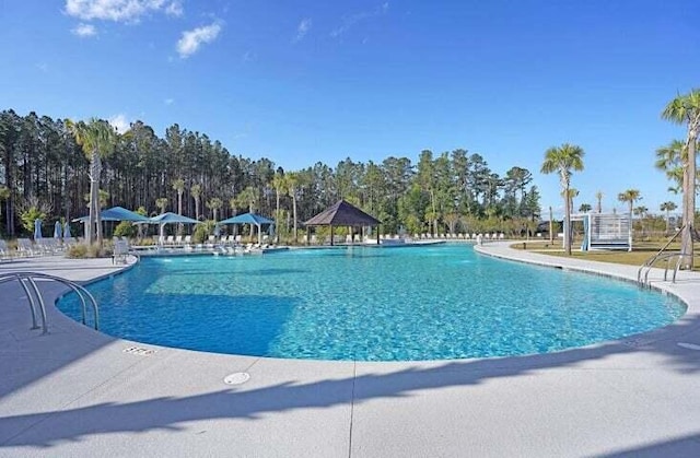 view of swimming pool featuring a gazebo