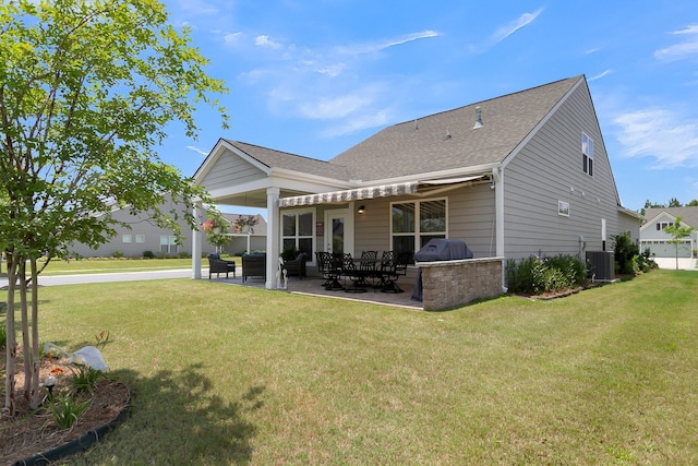 back of property featuring a lawn, central AC, and a patio area