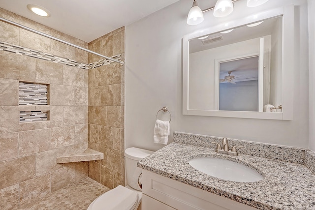 4587 Durant Ave, North Charleston, SC 29405 - bathroom featuring a tile shower, toilet, and vanity