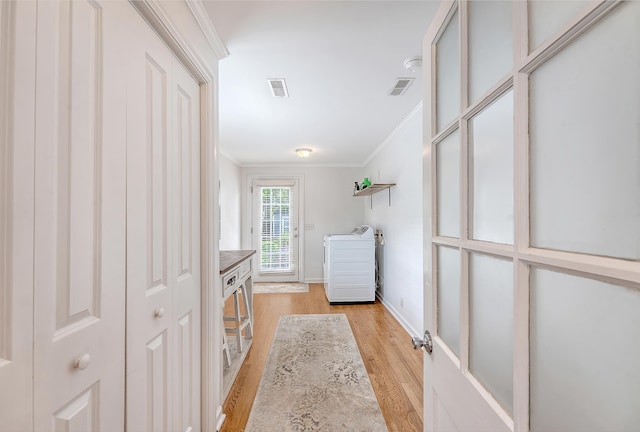 4587 Durant Ave, North Charleston, SC 29405 - hallway with crown molding, light wood-style flooring, washer / clothes dryer, and baseboards