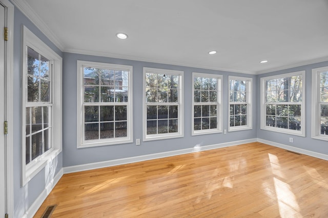 unfurnished sunroom featuring a healthy amount of sunlight