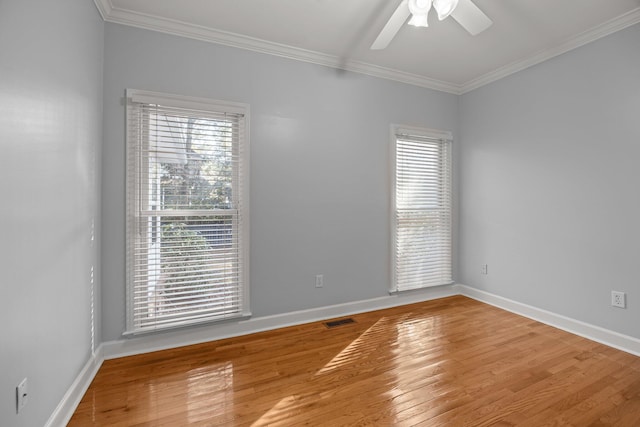 unfurnished room featuring wood-type flooring, ornamental molding, and ceiling fan