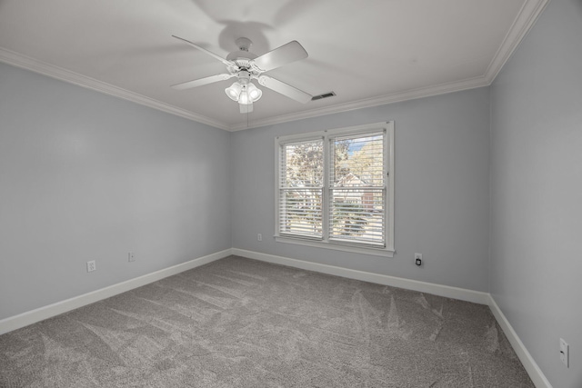 carpeted spare room featuring ornamental molding and ceiling fan