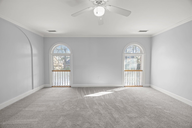 unfurnished room with ornamental molding, light colored carpet, and ceiling fan