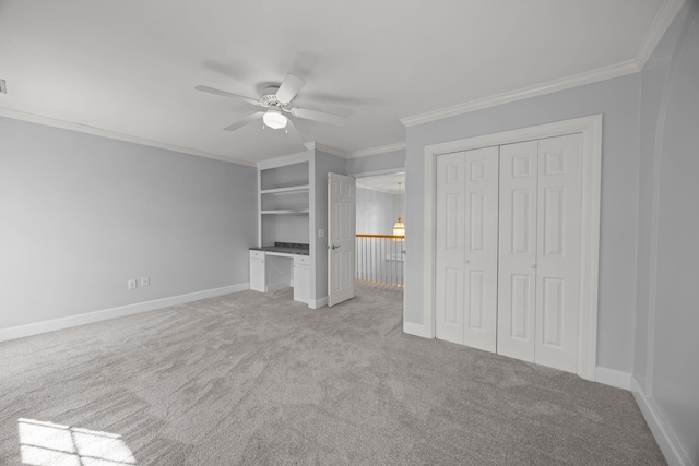 unfurnished bedroom featuring crown molding, light colored carpet, and ceiling fan