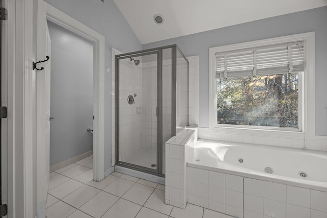 bathroom with vaulted ceiling, tile patterned floors, and independent shower and bath