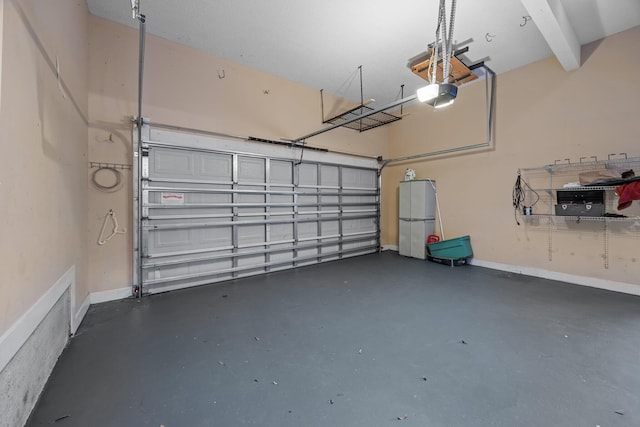 garage featuring fridge and a garage door opener