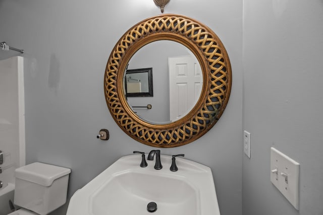 bathroom featuring sink and toilet