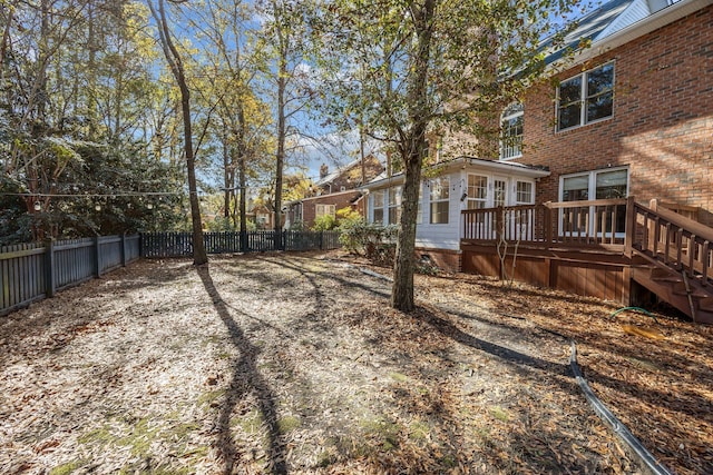 view of yard with a wooden deck