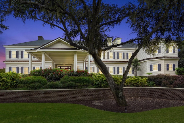 5558 Green Dolphin Way, Kiawah Island, SC 29455 - neoclassical / greek revival house featuring a chimney and a lawn