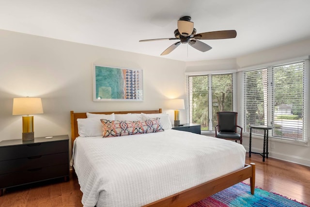 5558 Green Dolphin Way, Kiawah Island, SC 29455 - bedroom featuring multiple windows, wood finished floors, and ceiling fan