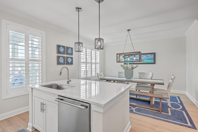 kitchen with sink, decorative light fixtures, a center island with sink, dishwasher, and white cabinets