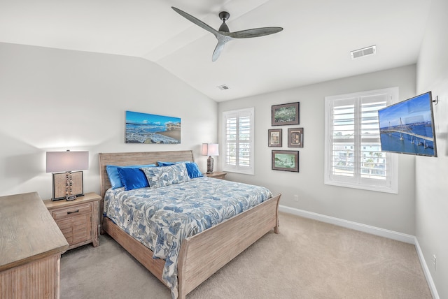 carpeted bedroom featuring vaulted ceiling and ceiling fan