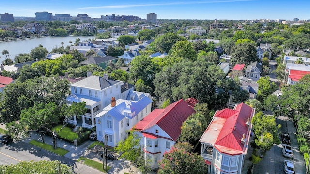 birds eye view of property with a water view