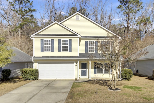 front facade with a garage and a front yard