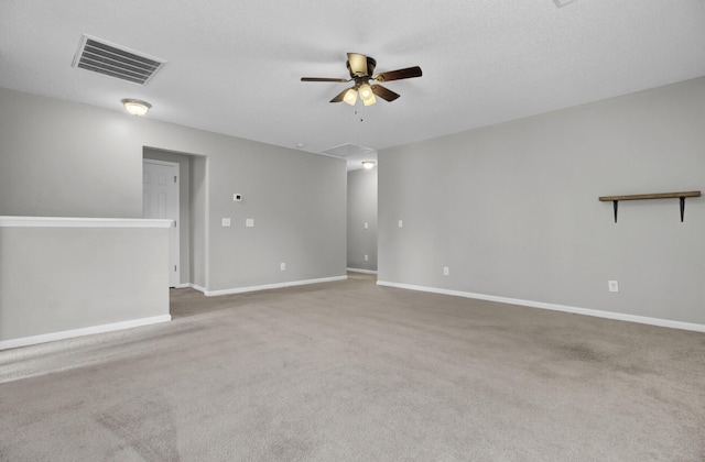 unfurnished room with ceiling fan and light carpet