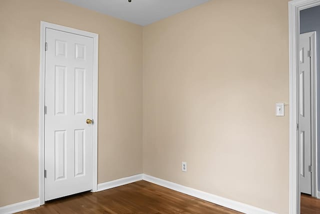 empty room featuring dark hardwood / wood-style floors