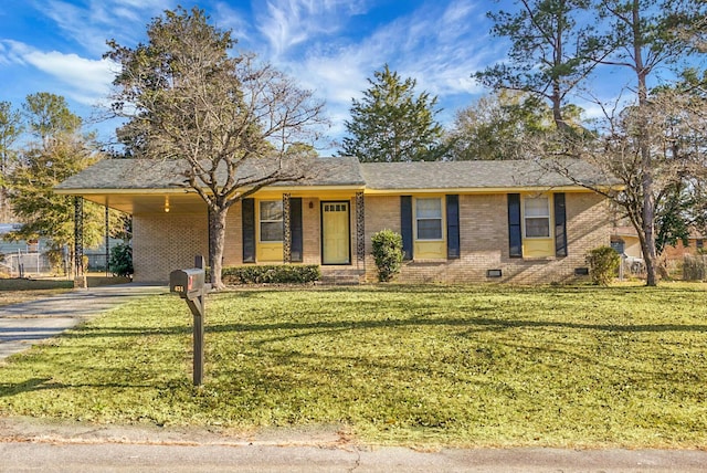 ranch-style home with a carport and a front lawn