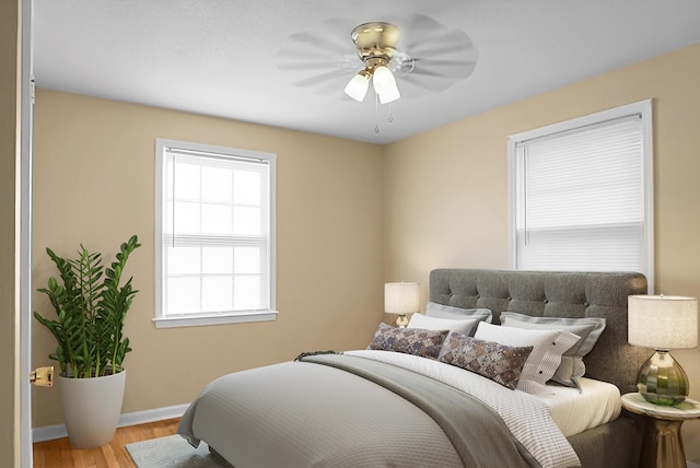 bedroom featuring ceiling fan and light hardwood / wood-style flooring