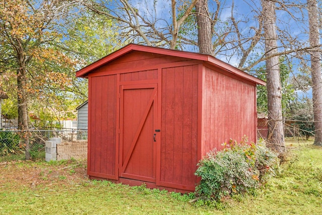 view of outbuilding with a lawn