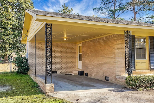 entrance to property with a carport