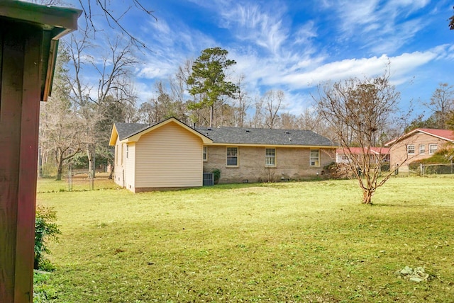 back of property featuring a lawn