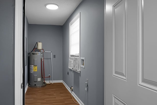 utility room with electric water heater