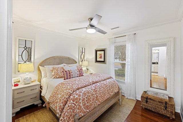 bedroom featuring dark hardwood / wood-style floors, ceiling fan, and crown molding