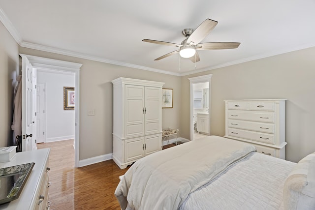 bedroom with light hardwood / wood-style flooring, ceiling fan, crown molding, and sink