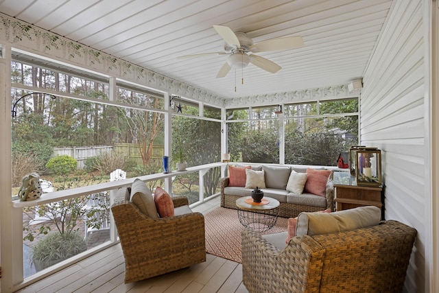 sunroom / solarium with ceiling fan