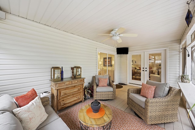 sunroom / solarium with french doors and ceiling fan