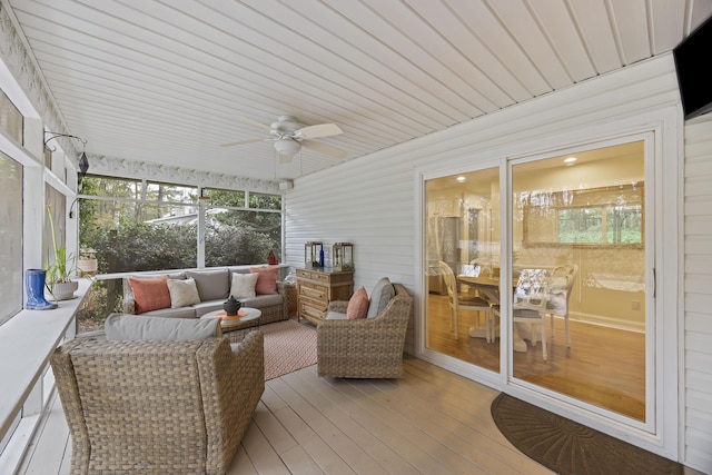 sunroom / solarium with ceiling fan