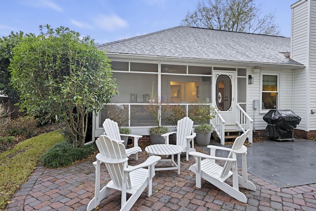 view of patio with a sunroom and grilling area