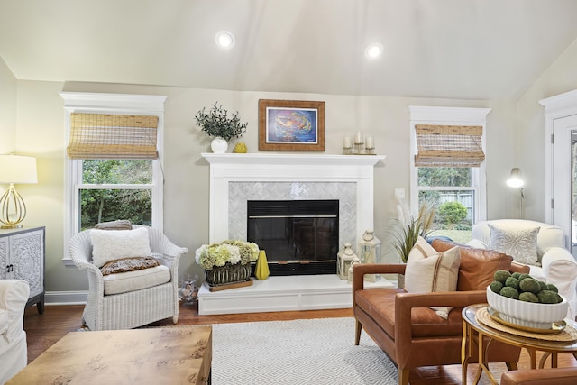 living area featuring hardwood / wood-style floors and vaulted ceiling