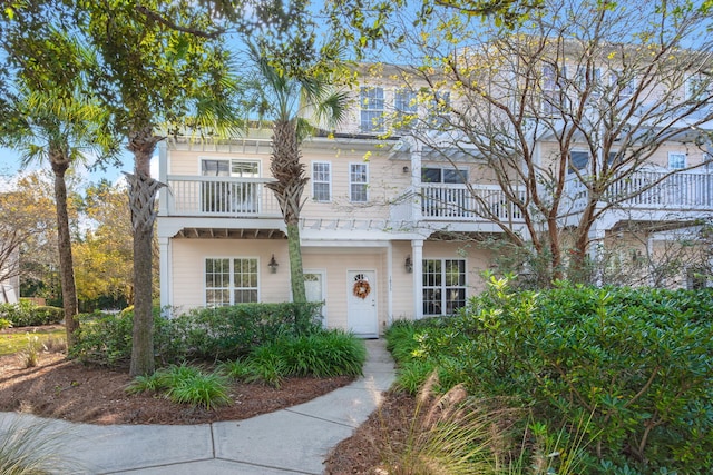 view of front of house featuring a balcony