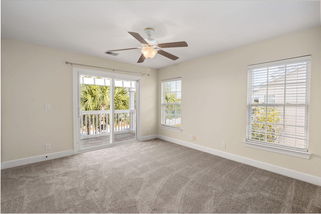 empty room featuring ceiling fan and carpet floors