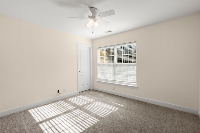 unfurnished room with carpet floors and ceiling fan