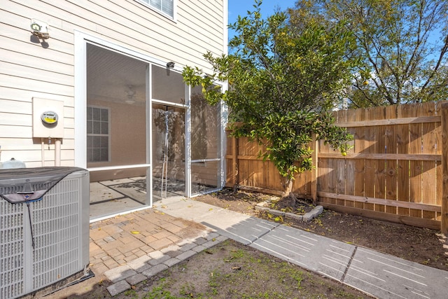 view of yard with a sunroom and cooling unit