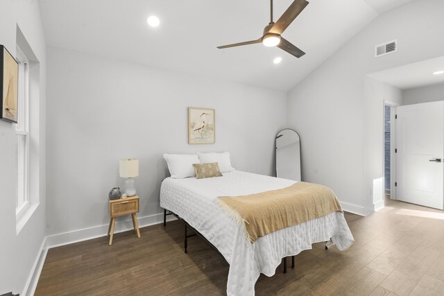 bedroom with ceiling fan, wood-type flooring, and lofted ceiling